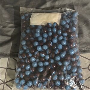 Blue and Black paint balls for a paintball